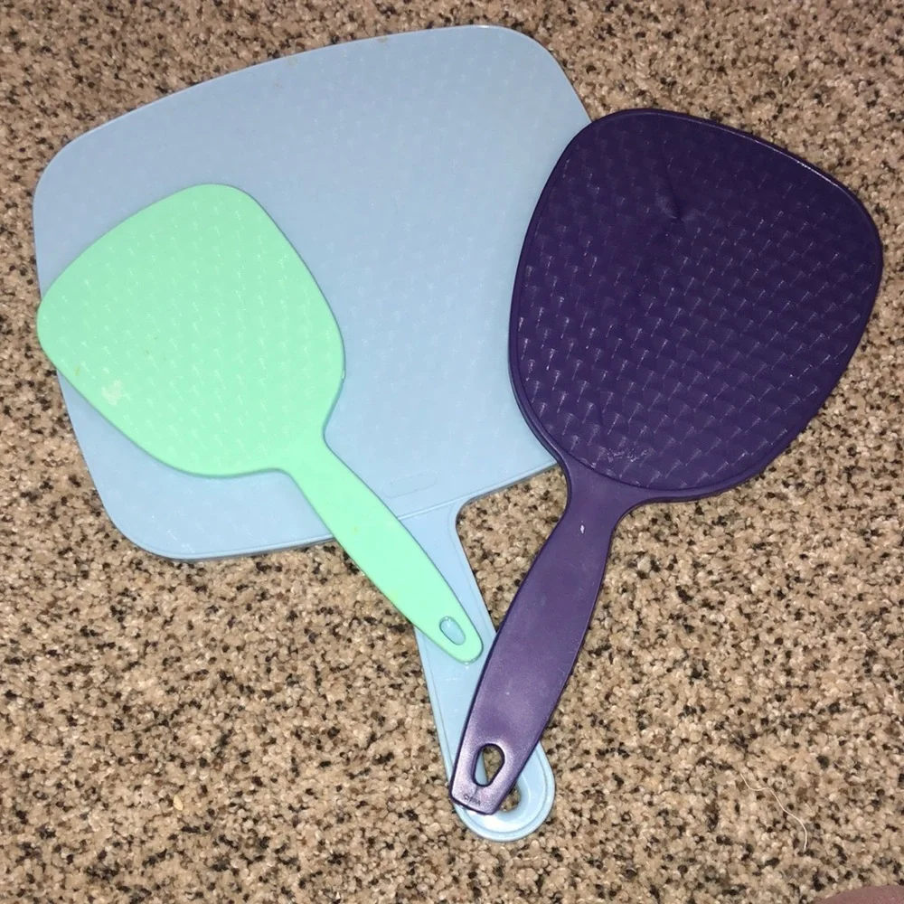 Three hand held mirrors. Good condition. The blue and the green one are vintage